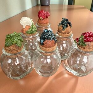 6 adorable little jars with decorated cork stoppers,marked Shonfeld’s, no damage